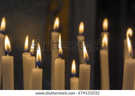 group of candles with a dark background