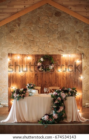 Wedding table with flowers and two glasses