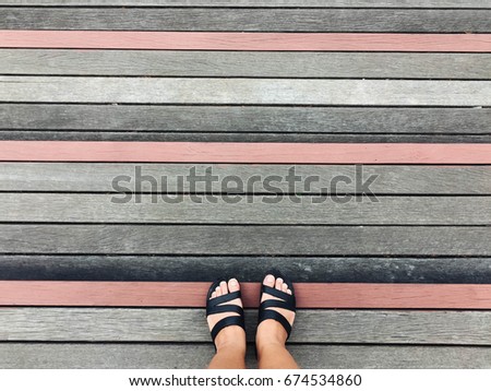 top view legs standing on the wood floor, copy space