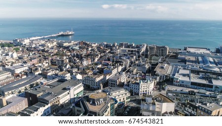 Aerial view of the town of Brighton and Hove towards the beach and the pier Royalty-Free Stock Photo #674543821