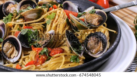 Close up view of delicious Italian spaghetti alle vongole (clams) Royalty-Free Stock Photo #674548045