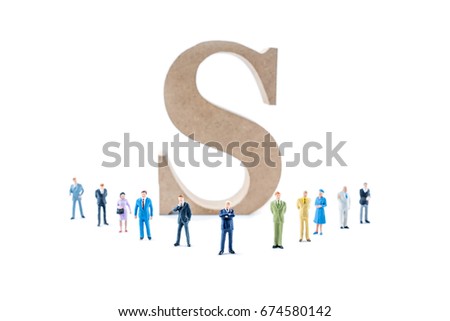 Miniature people teamwork with dollar sign background.