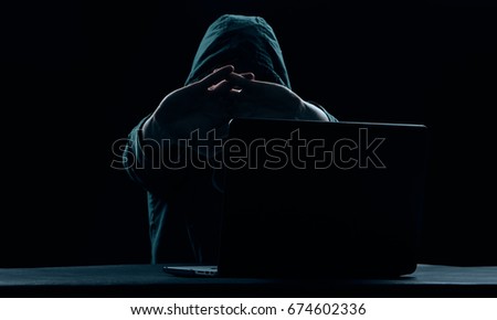 Hacker with laptop                               
