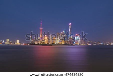 Shanghai city skyline with Huangpu river at nightfall