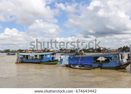 View of Mekong River with the dramatic cloudscape and boats in Ho Chi Minh, Vietnam