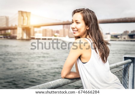 Beautiful woman portrait with Manhattan skyline in the background