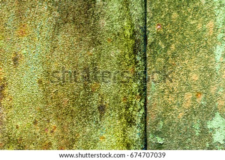 Old metal sheet with traces of corrosion and oxidation background texture