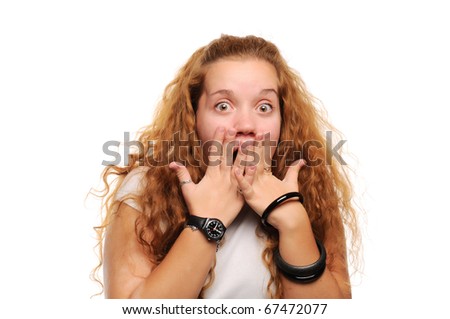 Cute ginger girl surprised, covering her mouth by hands