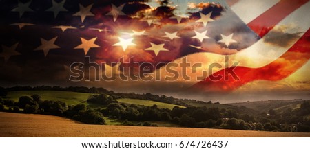 Cropped American flag against country scene