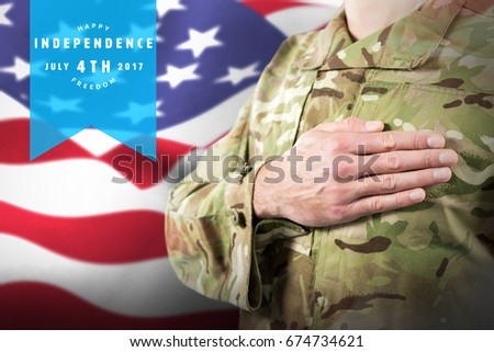Mid section of soldier in uniform taking oath against focus on usa flag