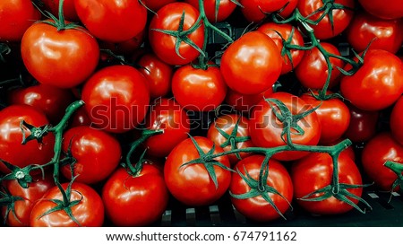 fresh tomatoes. red tomatoes background. Group of tomatoes Royalty-Free Stock Photo #674791162