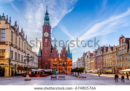 Market Square with Town Hall in Wroclaw, Poland early in the morning. Colorful cities concept.