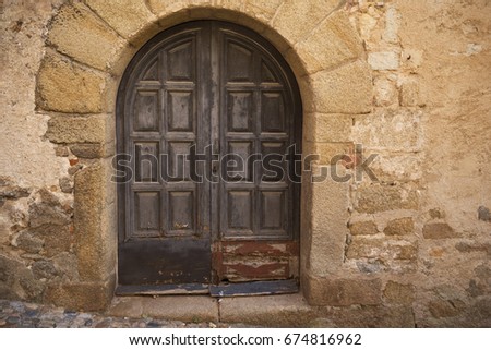 Old medieval gate. Old front door in the old alley in Tossa de Mar.