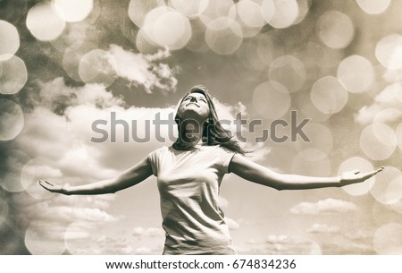 Girl at sky and bokeh lights background. Photo in old sepia image style