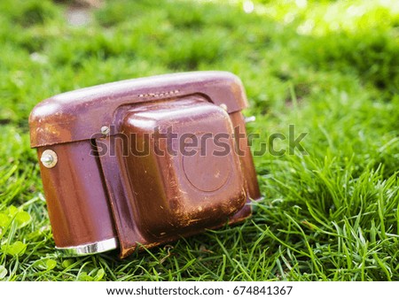 Retro photo camera in a leather case