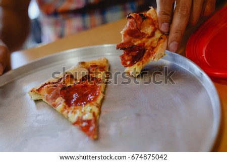 Closeup photography of homemade pepperoni pizza ready to eat and having good time. Colorful background