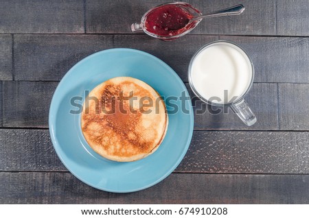 Small pancakes on a blue plate 