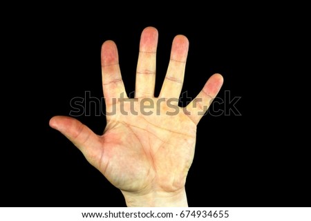 A hand with a black background 