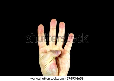 A hand with a black background 