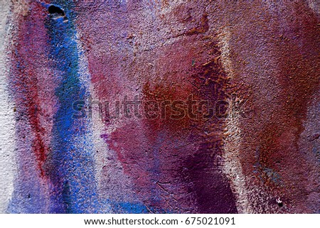 The old plastered brick wall with the remains of paint. Concrete, weathered, worn out wall is damaged by paint. Abstract background for creative design
