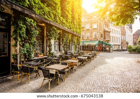 Street view with cafe terrace during the morning in Antwerpen city in Belgium Royalty-Free Stock Photo #675043138