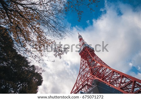tokyo tower in autumn with clouds blue sky