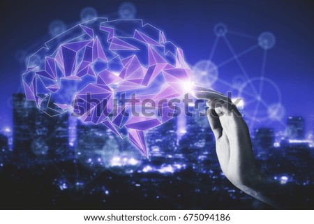 Hand touching abstract illuminated polygonal brain on night city background. Technology and knowledge concept. Double exposure 