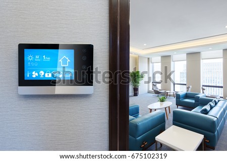 smart screen with smart home apps on wall in modern living room Royalty-Free Stock Photo #675102319