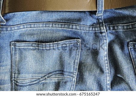 Jeans with leather belt