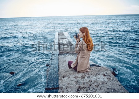 Woman on the pier, the sea                               