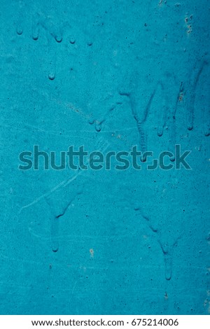 Texture of the old wall, painted in blue paint. Background for design with space for text.