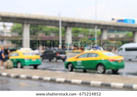 Abstract  blurred image of traffic jam after raining in  victory monument area, Bangkok, Thailand.