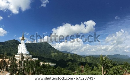 Big buddha by the blue sky hill side