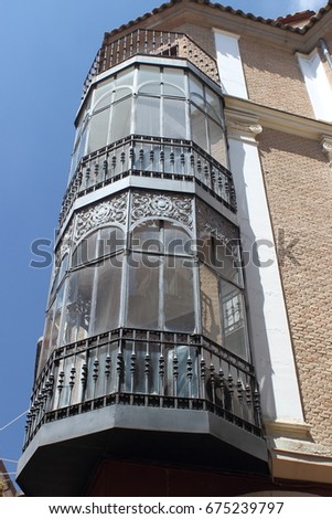 Typical balconies with metal lattices in a building on a street in Toledo, Spain, World Heritage city,