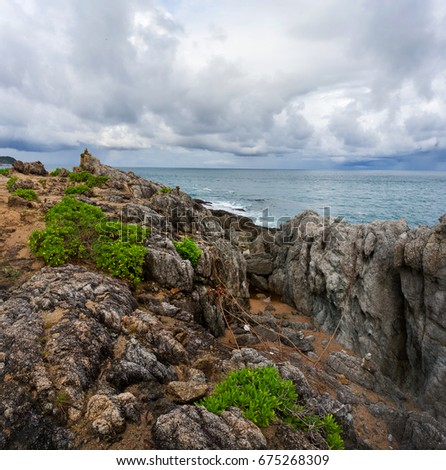 Rocky coast of the Andaman Sea, rocks and blue water
