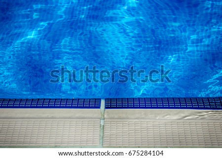 Swimming pool water Royalty-Free Stock Photo #675284104