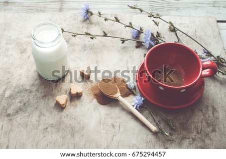 Cup with chicory drink on a wooden background/toned photo