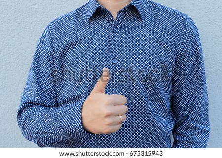 Business man giving thumb up sign