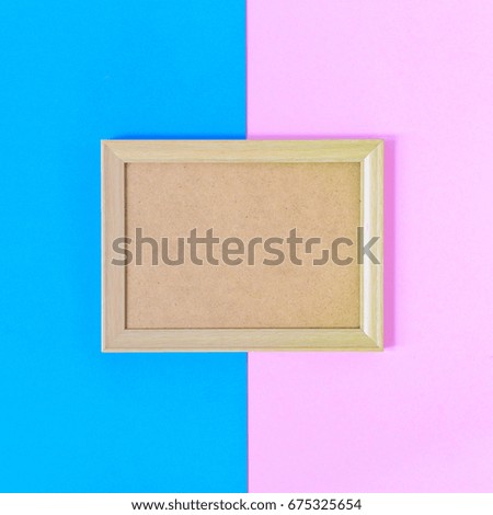 Photo wood frame on colorful paper wall background With memories and nobody