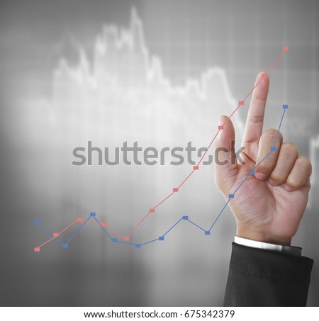 Financial symbols coming from a hand