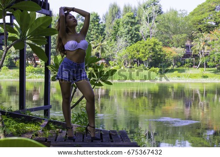 Asian girl posing outdoors