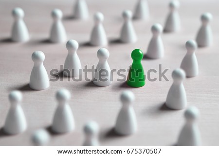 One different board game pawn. Individuality, independence, leadership and uniqueness concept. Stand out from the crowd. Think outside the box. Dare to be different. Royalty-Free Stock Photo #675370507