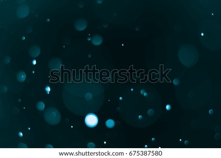 abstract bokeh background dark teal color