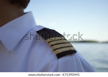 Closeup Of Captain's Epaulettes Royalty-Free Stock Photo #675390445