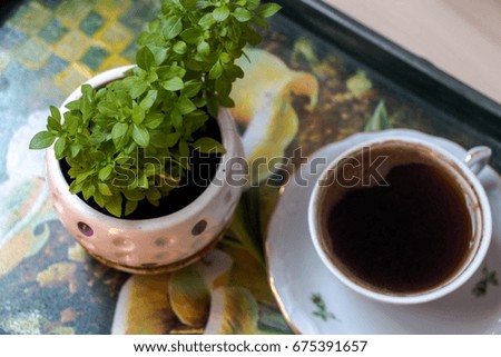 Coffee and flowers on a flowery tray, homemade design