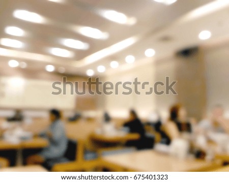 Blurred people dining in restaurant background