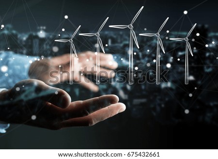 Businessman on blurred background hloding renewable energy sketch