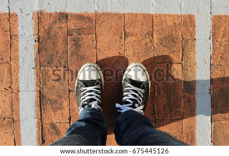 Top view of a man's legs and shoes. Self isolation concept image. 