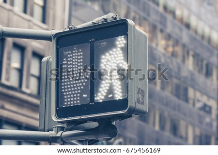 Close up of traffic signal on city street. 