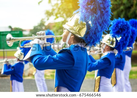 Trumpet brass band in uniform performing